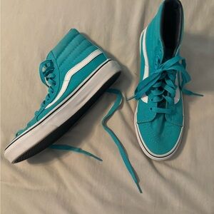 Teal and White Vans high tops